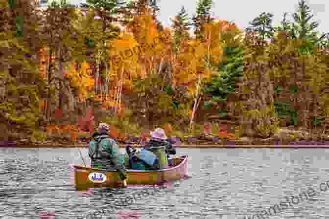 A Canoeist Paddles Through A Tranquil Lake In Quetico Provincial Park. Quetico: Near To Nature S Heart