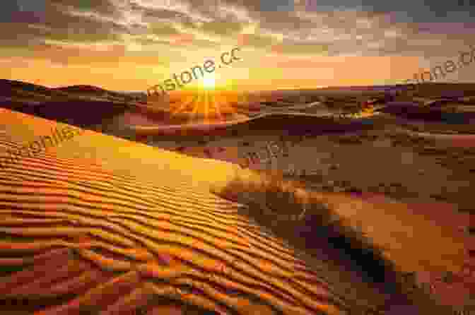 A Golden Sunset Over A Vast Desert Landscape, With The Sun Casting A Warm Glow On The Sand Dunes And Creating A Sense Of Awe And Wonder. Sunsets Werner Stejskal