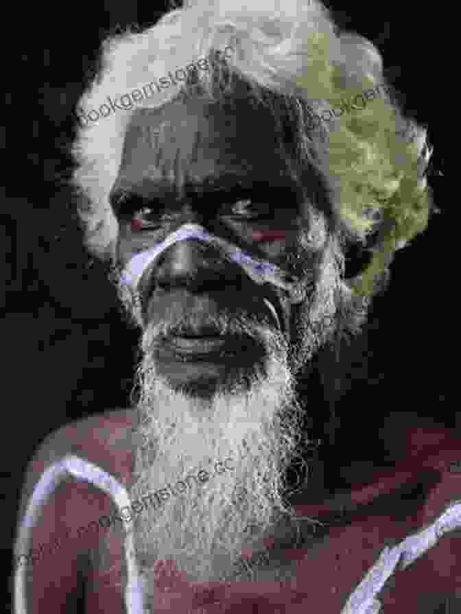 An Elderly Aboriginal Man With Weathered Skin And Piercing Eyes, Standing Against A Backdrop Of The Rugged Outback Landscape. Bill S Story: Memories Of Outback Roads And Characters